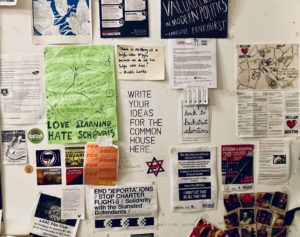 An array of posters in the Common House